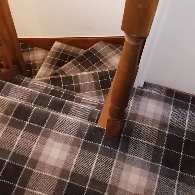 Tartan carpet on landing and stairs